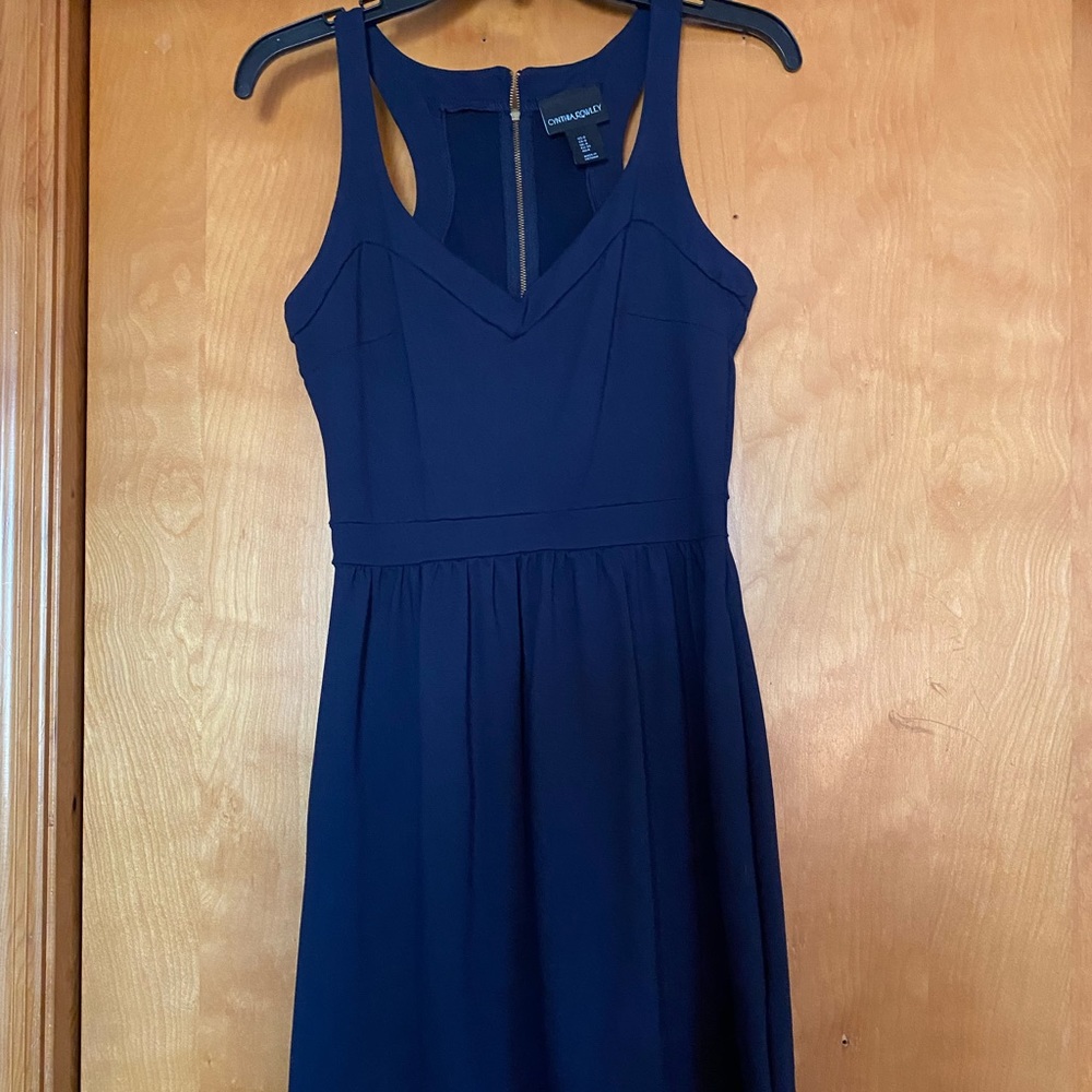 Navy blue, gold zipper in the back, thick material